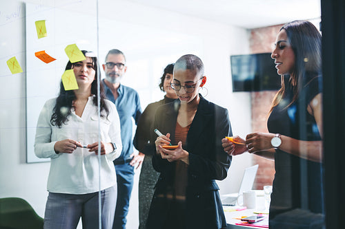 Group of businesspeople sharing their ideas in an office