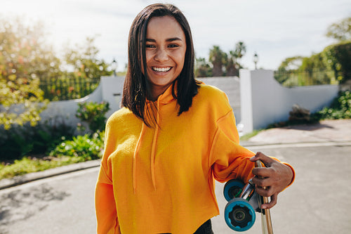 Portrait of a smiling girl standing outdoors