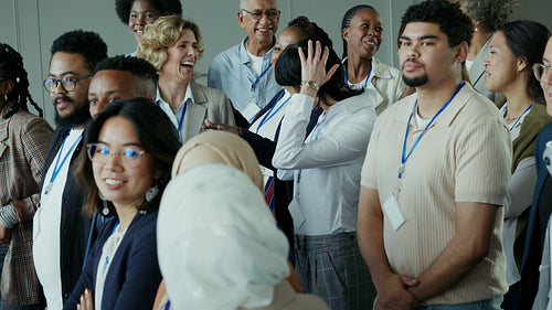 Happy business people smiling and networking at a professional conference