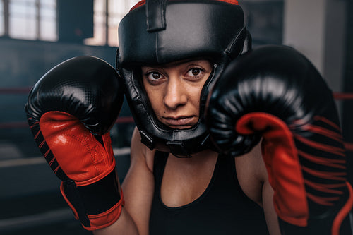 Female boxer geared up for a bout