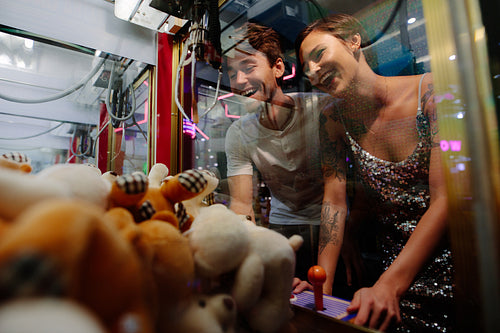 Couple playing games at a gaming arcade