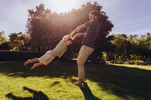 Man playing with his son in the park