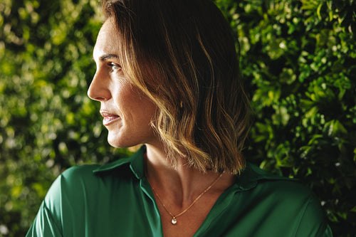 Woman with an eco-friendly ambition standing in a green office