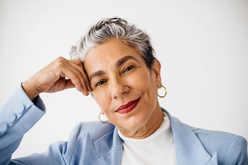 Mature business woman with silver hair looking at the camera
