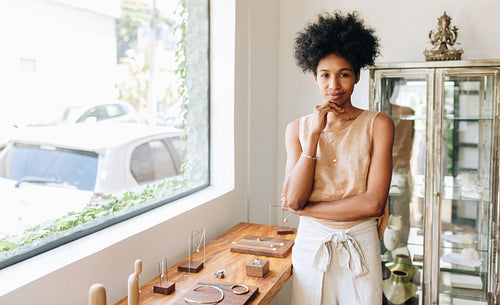 Entrepreneur standing in jewelry studio