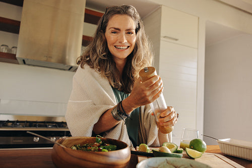 Vegetarian woman preparing a wholeseome plant-based meal at home