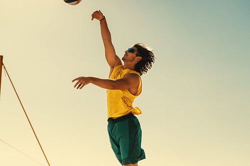 Dynamic beach volleyball action by young athlete in brazil