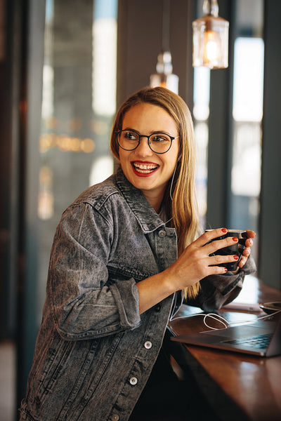 Happy woman relaxing at a cafe