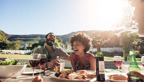 Group of friends enjoying outdoor summer meal