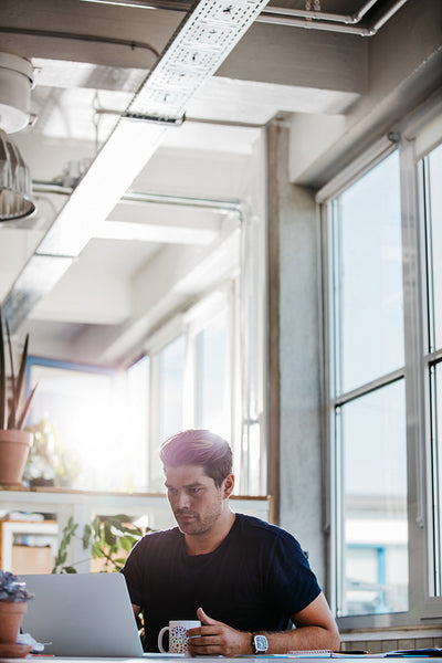 Young creative professional working at his desk