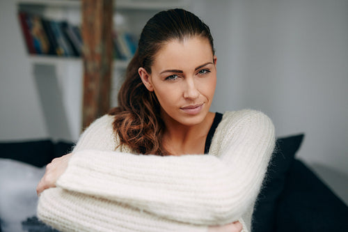 Attractive young lady sitting relaxed at home