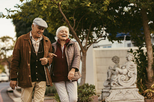 Senior couple walking outdoors on winter day