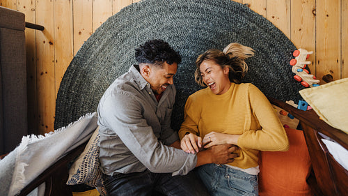 Overhead view of a married couple laughing together