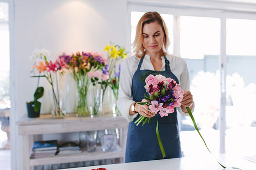 Female florist preparing a bouquet