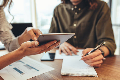 Business colleagues discussing work in office