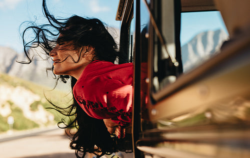 Woman enjoying a car ride 