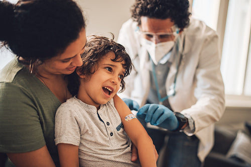Boy getting vaccinated at home
