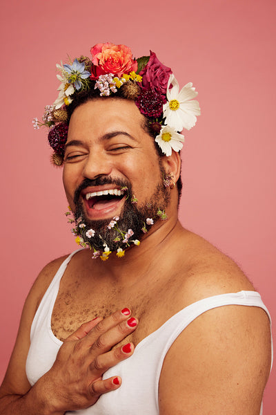 Smiling queer wearing makeup