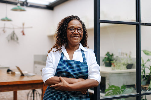 Mature small business owner running a successful flower store