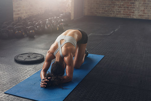 Fit young woman doing pilates workout at the gym