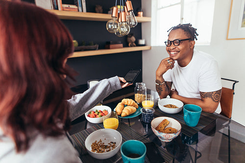 Couple having breakfast together at home