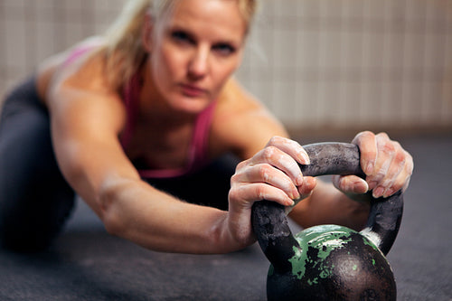 Woman Resting During Kettlebell Workout