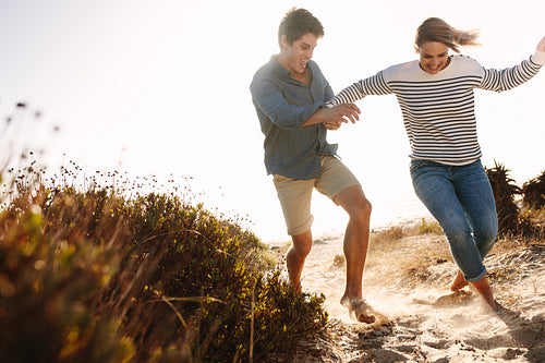 Couple enjoying and having fun on the beach