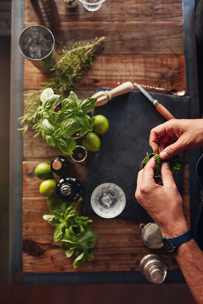 Barman experimenting with new cocktail preparation ideas