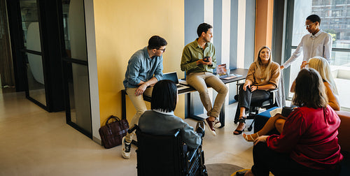 Diverse group of people having a meeting in a modern office workspace