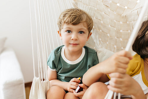 Innocent boy sitting at home