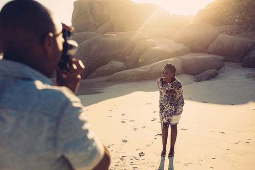 Young man taking picture of his girlfriend