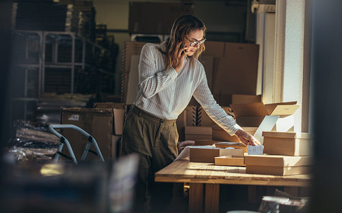 Woman providing the shipment status to the customer