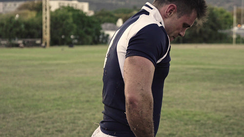 Rugby player looking tired after the game