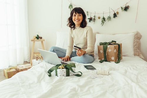Woman using credit card to make online payment