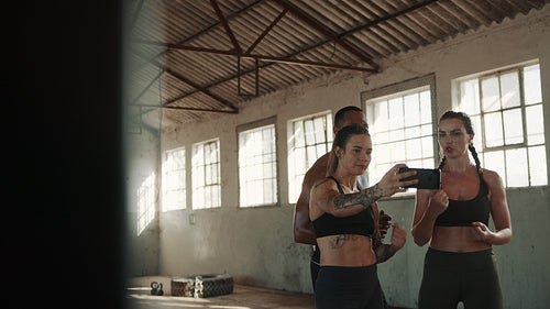 Fitness people taking selfie after workout