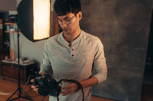 Photographer setting up his camera before the shoot