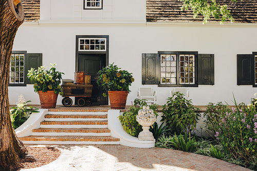 Luxury hotel entrance with a cart outside the door