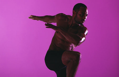 Fit man working on core strength training