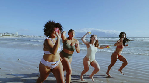 Friends having fun on beach holiday