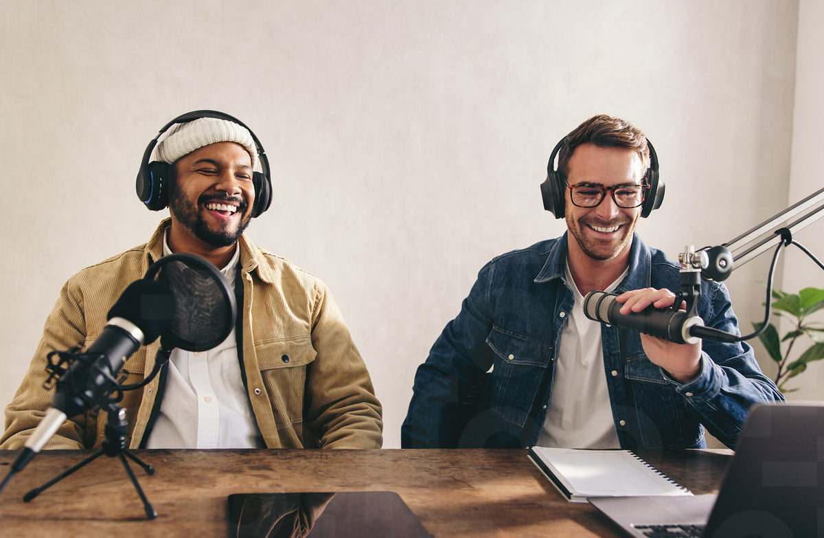 Male radio presenters having a great time in a studio – Jacob Lund ...