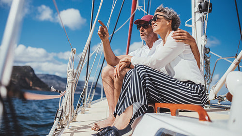 Senior couple on a boat ride during their summer vacation