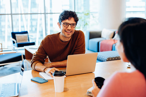 Man at meeting with laptop