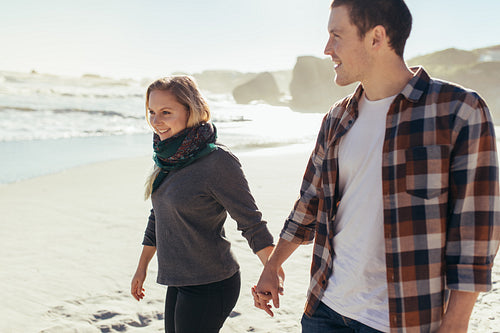 Loving couple walking along the beach