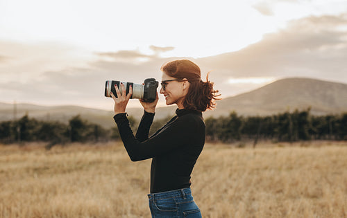 Female photographer shooting outdoors