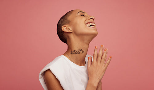 Smiling gen z female on pink background