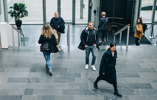 Business people walking through a office hallway