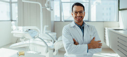 Dentist portrait in a modern dental clinic with professional healthcare service concept