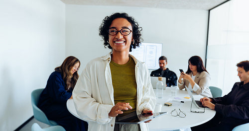 Woman leads a diverse UX team meeting