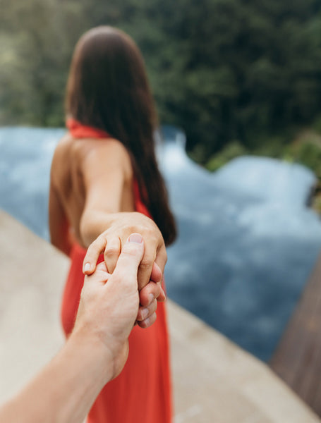 Man holding hand of his girlfriend