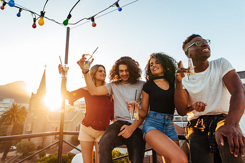 Group of friends having a rooftop party